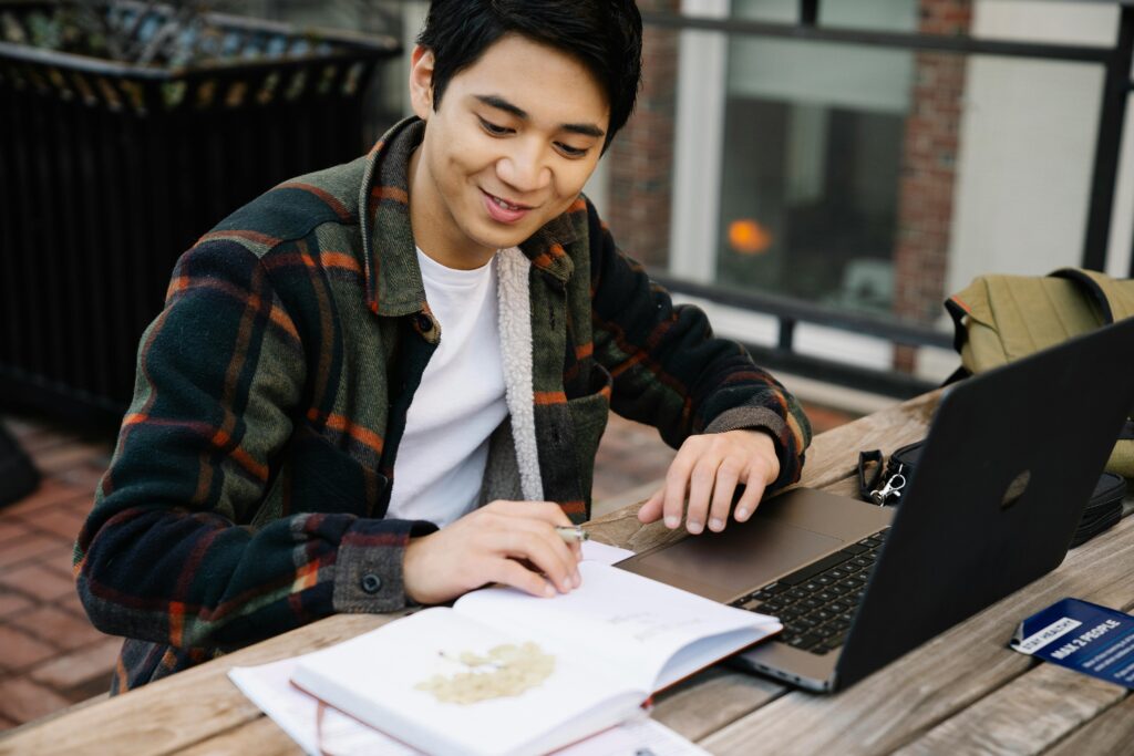 student working on laptop for career opportunities in europe
